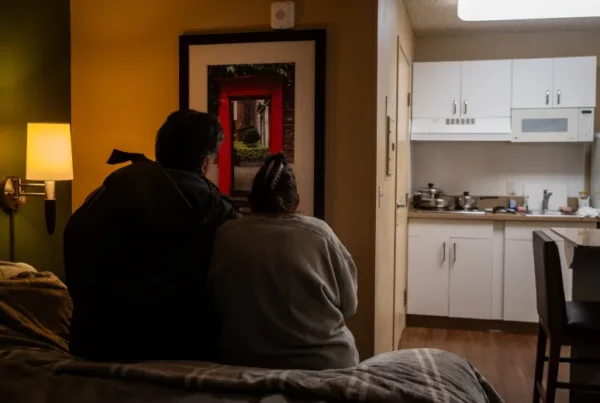 couple sitting on a bed